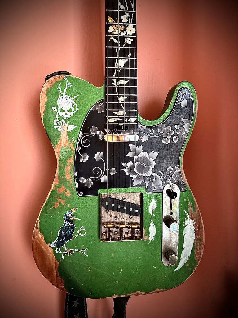my beat to crap modded $180 chinese telecaster copy, named Birdie